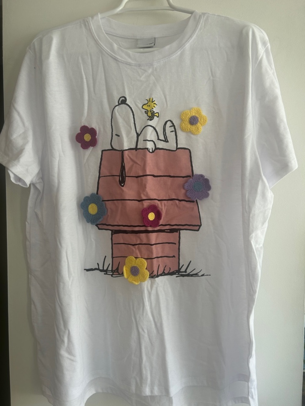 White women’s Snoopy Graphic Tee with Crochet Flowers